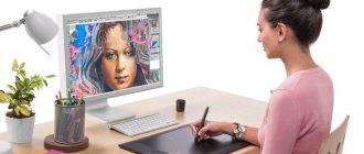 Girl draws on a graphics tablet
